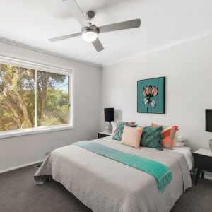 Styled bedroom with aqua accents - Melbourne Property Styling - Leeder Interiors