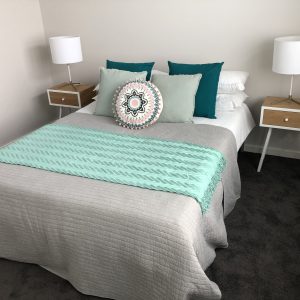 Styled bedroom with aqua accents - Interior Decorator Service - Leeder Interiors