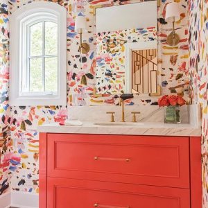 A bright colourful bathroom with wallpaper and coral vanity - colourful interior design Melbourne - Leeder Interiors