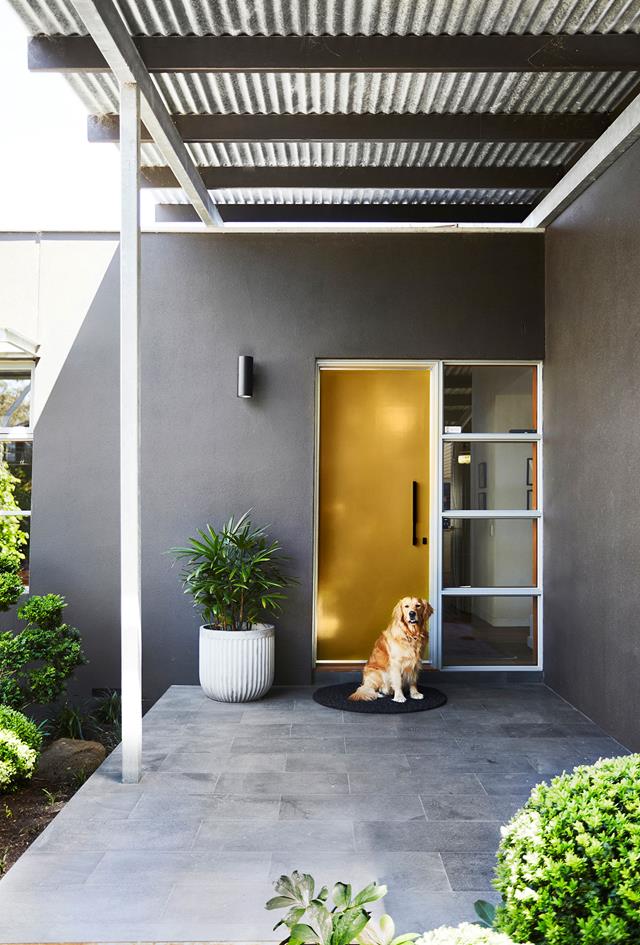 A mustard coloured front door on a grey home - Melbourne Interior Design - Leeder Interiors