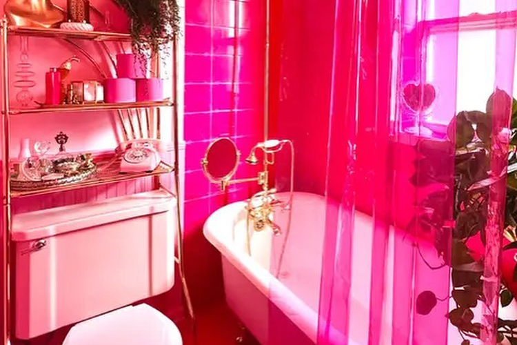A bathroom decorated in hot pink, inspiration for a barbiecore interior.
