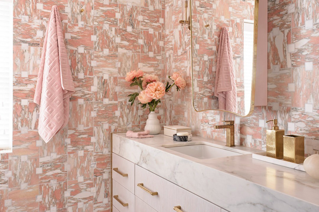 A bathroom scene tastefully decorated in pink and white tones, inspiration for a barbiecore interior.